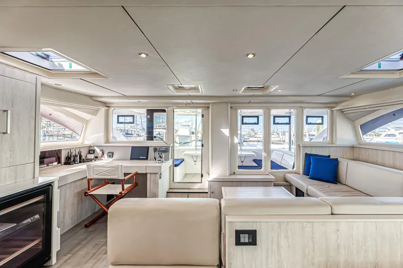 Aquarius Yacht Photos Pics Luxurious interior of 2016 Leopard 58 yacht with modern seating and large windows.