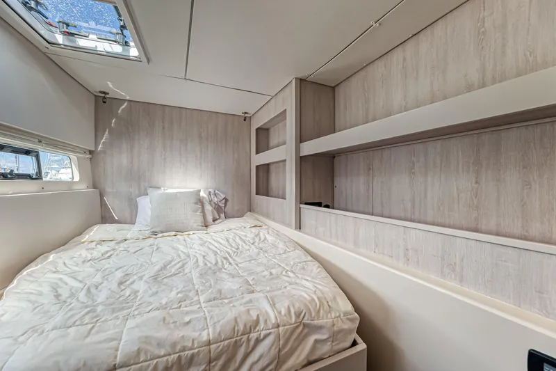 Aquarius Yacht Photos Pics Luxurious bedroom interior of 2016 Leopard 58 yacht with cozy bedding and modern design.