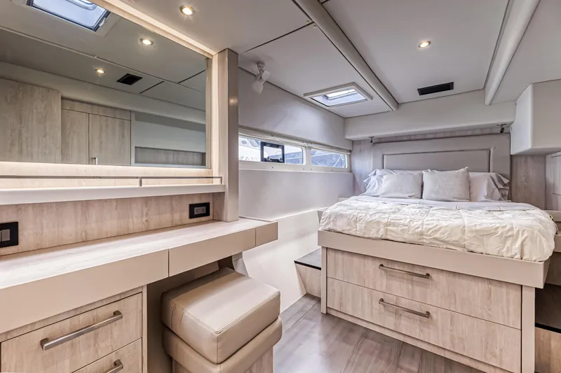 Aquarius Yacht Photos Pics Luxurious bedroom interior of 2016 Leopard 58 yacht with modern furnishings and ample natural light.