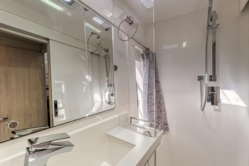 Aquarius Yacht Photos Pics Modern bathroom in 2016 Leopard 58 yacht with sleek fixtures and mirrored cabinets.