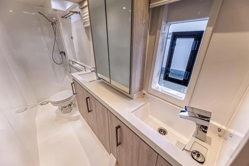 Aquarius Yacht Photos Pics Luxurious bathroom in a 2016 Leopard 58 yacht with modern fixtures and sleek design.