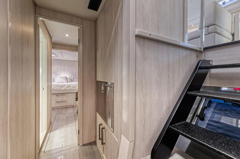 Aquarius Yacht Photos Pics Interior of 2016 Leopard 58 yacht, featuring modern hallway and staircase design.