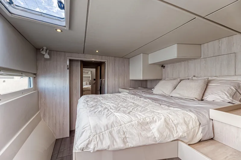 Aquarius Yacht Photos Pics Luxurious bedroom interior of 2016 Leopard 58 yacht with modern design and comfortable bedding.