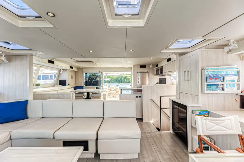 Aquarius Yacht Photos Pics Luxurious interior of 2016 Leopard 58 yacht with modern furnishings and ample natural light.