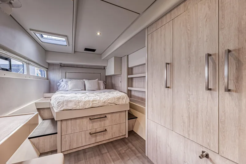 Aquarius Yacht Photos Pics Luxurious bedroom interior in 2016 Leopard 58 yacht with modern wood finishes and skylight.