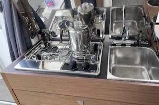  Yacht Photos Pics 2021 Jeanneau NC 895 boat kitchen with stove and sink.