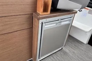  Yacht Photos Pics Compact refrigerator in 2021 Jeanneau NC 895 boat interior.