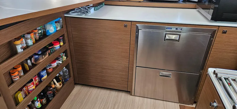 Night Out Yacht Photos Pics Modern kitchen interior of 2023 Nautitech 44 Open yacht with stainless steel appliances.