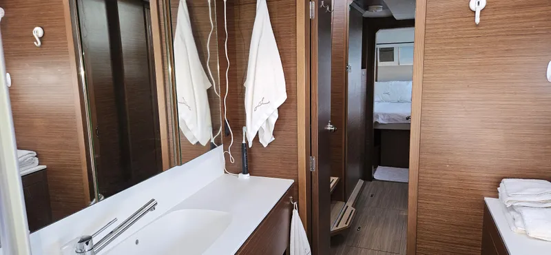 Night Out Yacht Photos Pics Interior of 2023 Nautitech 44 Open yacht, featuring modern bathroom and cozy cabin.
