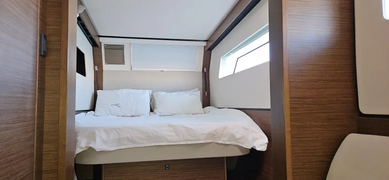 Night Out Yacht Photos Pics Interior cabin of 2023 Nautitech 44 Open catamaran with bed and window.