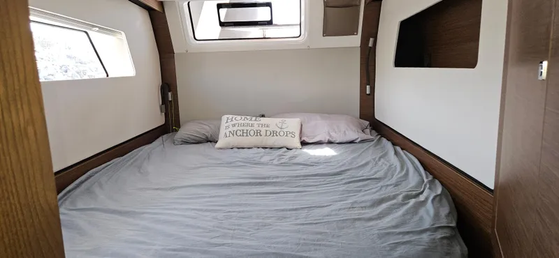 Night Out Yacht Photos Pics 2023 Nautitech 44 Open cabin with cozy bed and decorative pillow.
