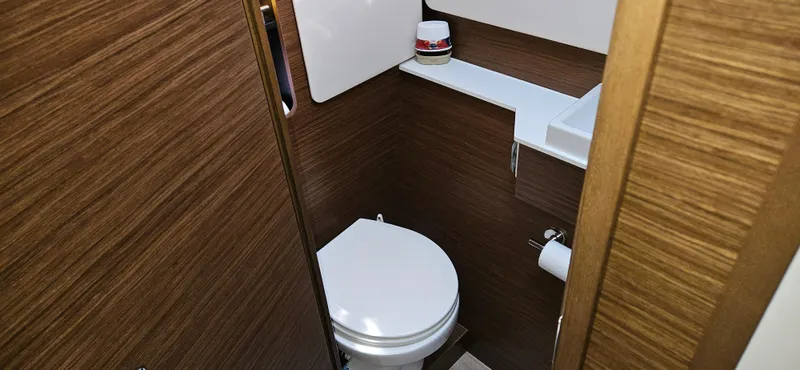 Night Out Yacht Photos Pics 2023 Nautitech 44 Open yacht bathroom with modern wood finish and compact design.