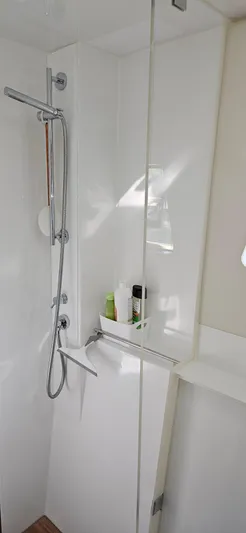 Night Out Yacht Photos Pics Modern shower area in 2023 Nautitech 44 Open yacht, featuring sleek design and amenities.