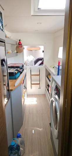 Night Out Yacht Photos Pics Interior of 2023 Nautitech 44 Open catamaran, featuring modern kitchen and cozy living space.