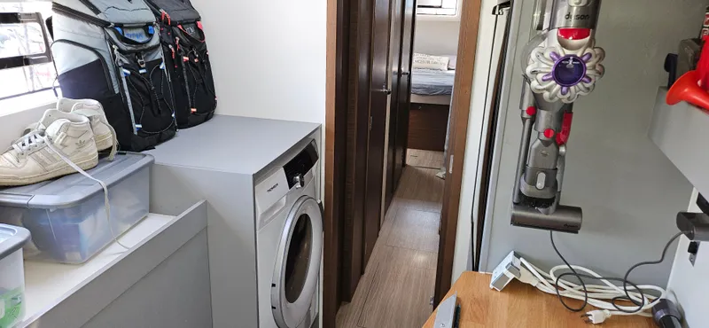 Night Out Yacht Photos Pics Laundry area in 2023 Nautitech 44 Open yacht with washing machine and storage.