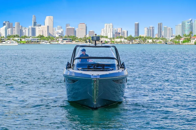  Yacht Photos Pics 2020 Princess R35 yacht cruising near city skyline on a sunny day.