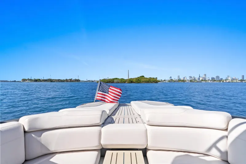  Yacht Photos Pics Luxury yacht Princess R35, 2020 model, with American flag on open water.