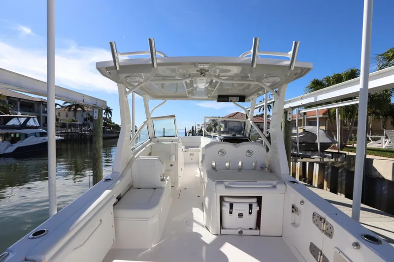  Yacht Photos Pics 2021 Edgewater 262CX Crossover boat docked, showcasing spacious interior and sleek design.