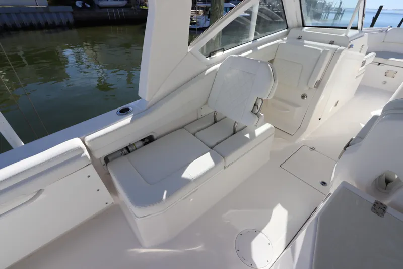  Yacht Photos Pics 2021 Edgewater 262CX Crossover boat interior with white seating and sleek design.