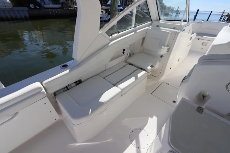  Yacht Photos Pics 2021 Edgewater 262CX Crossover boat interior with white seating and sleek design.