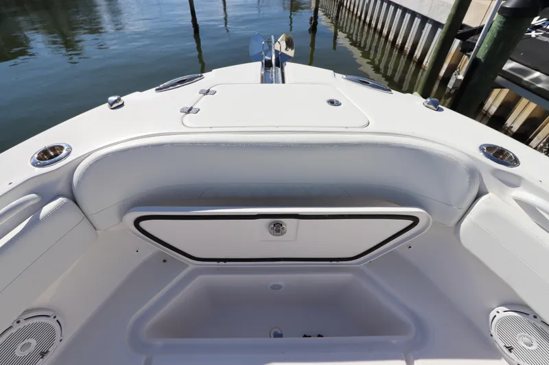  Yacht Photos Pics 2021 Edgewater 262CX Crossover boat interior with seating and storage compartments.