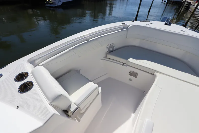  Yacht Photos Pics 2021 Edgewater 262CX Crossover boat interior with white seating and cup holders.