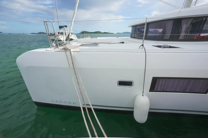 Apres Sail Yacht Photos Pics 2019 Lagoon 42 catamaran docked in serene turquoise waters.