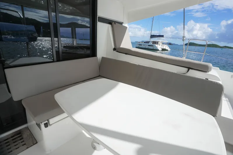 Apres Sail Yacht Photos Pics 2019 Lagoon 42 yacht interior with seating area and ocean view.