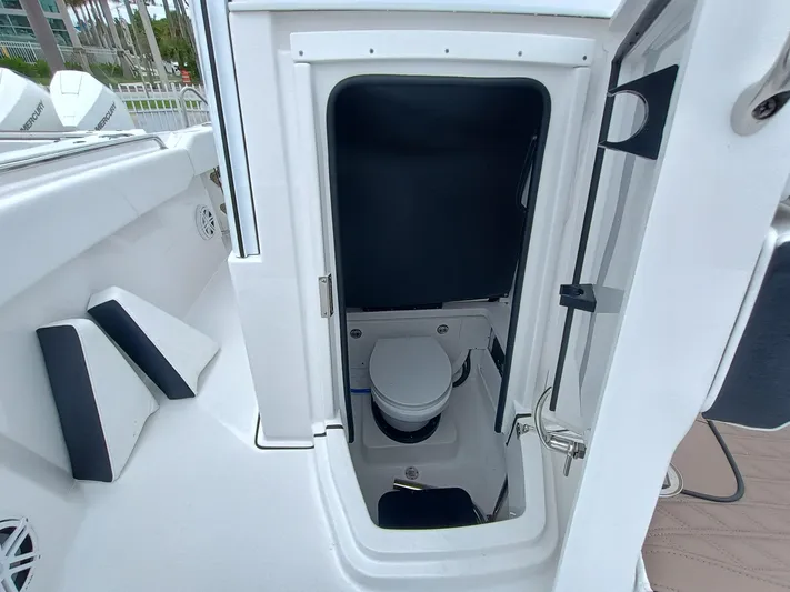 252-449 Yacht Photos Pics 2025 Blackfin 252 CC boat interior with compact marine toilet.