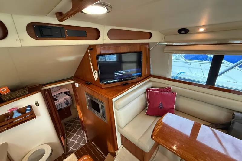  Yacht Photos Pics Interior of 2005 Riviera 40 Flybridge yacht with cozy seating and modern amenities.