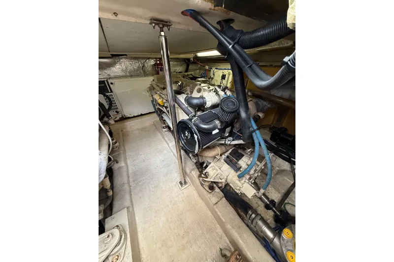  Yacht Photos Pics Engine room of 2005 Riviera 40 Flybridge yacht, showcasing mechanical components and wiring.