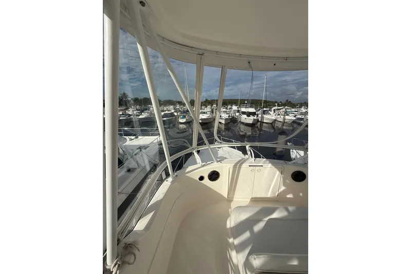  Yacht Photos Pics 2005 Riviera 40 Flybridge yacht interior with marina view.