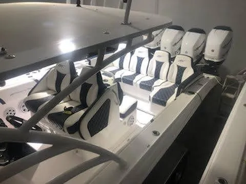  Yacht Photos Pics 2019 Midnight Express 39 Cuddy boat interior with luxurious seating and multiple engines.