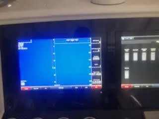  Yacht Photos Pics Dashboard of a 2019 Midnight Express 39 Cuddy boat with navigation screens.