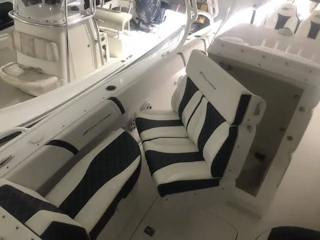  Yacht Photos Pics 2019 Midnight Express 39 Cuddy boat interior with cushioned seating and sleek design.