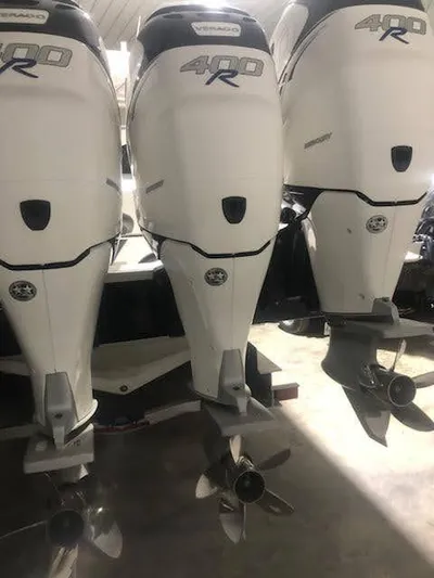  Yacht Photos Pics 2019 Midnight Express 39 Cuddy with triple 400R outboard engines in a garage.