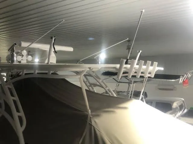  Yacht Photos Pics 2019 Midnight Express 39 Cuddy boat stored indoors, covered and equipped with antennas.