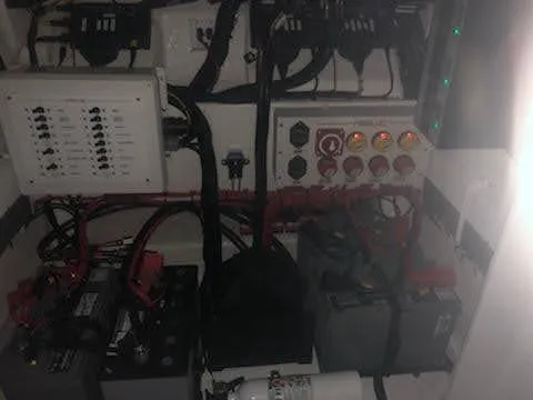  Yacht Photos Pics Electrical system of a 2019 Midnight Express 39 Cuddy boat, featuring batteries and control panels.