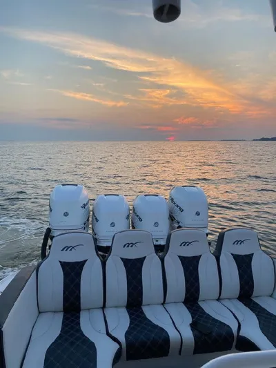  Yacht Photos Pics 2019 Midnight Express 39 Cuddy boat at sunset on the ocean.