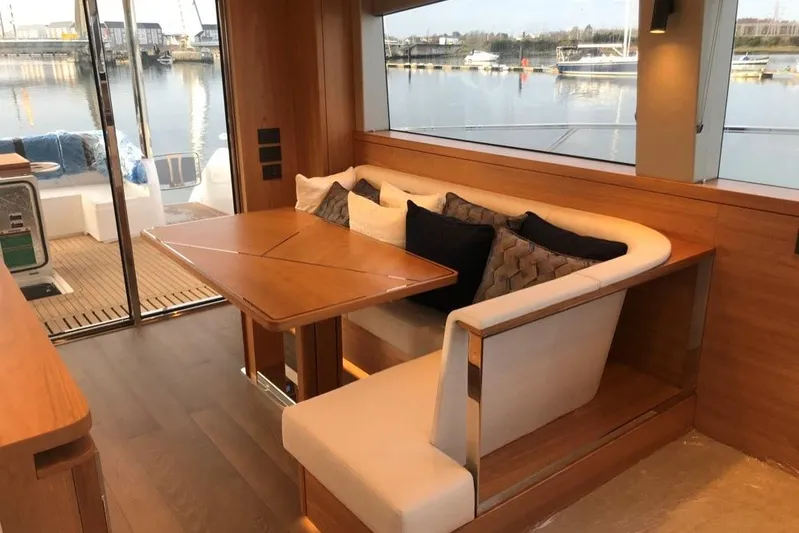 Alexstar Yacht Photos Pics Luxurious interior of 2021 Sunseeker Manhattan 68 yacht with elegant dining area.