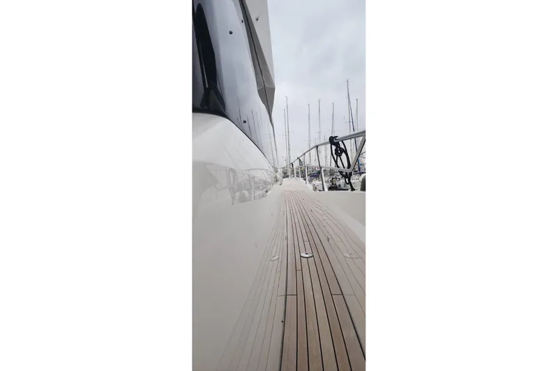 Alexstar Yacht Photos Pics 2021 Sunseeker Manhattan 68 yacht deck with sleek design and marina view.