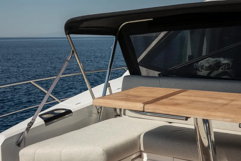 Alexstar Yacht Photos Pics Luxurious Sunseeker Manhattan 68 yacht deck with seating and table, 2021 model.