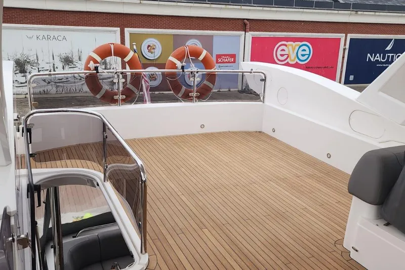 Alexstar Yacht Photos Pics Sunseeker Manhattan 68 yacht deck, 2021 model, featuring sleek wooden flooring and modern design.