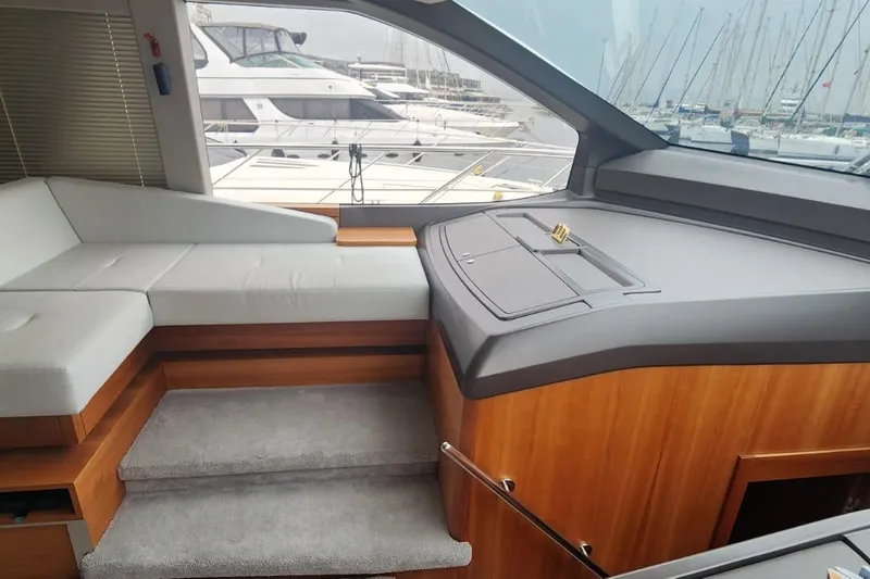 Alexstar Yacht Photos Pics Luxurious interior of 2021 Sunseeker Manhattan 68 yacht with plush seating and elegant design.