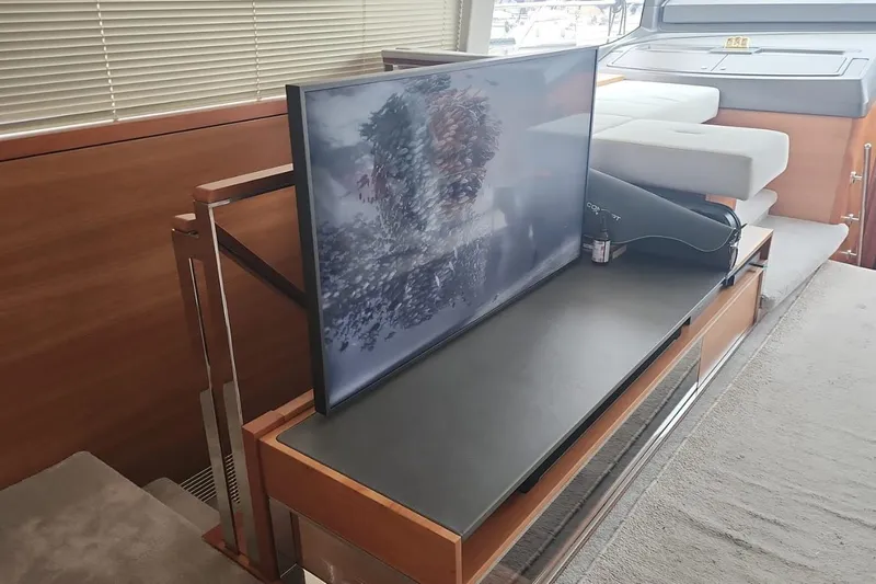 Alexstar Yacht Photos Pics Luxurious interior of 2021 Sunseeker Manhattan 68 yacht with modern TV setup.