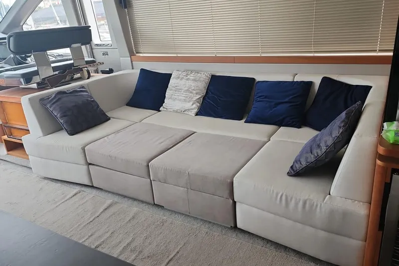 Alexstar Yacht Photos Pics Luxurious interior of 2021 Sunseeker Manhattan 68 yacht with plush seating and cushions.