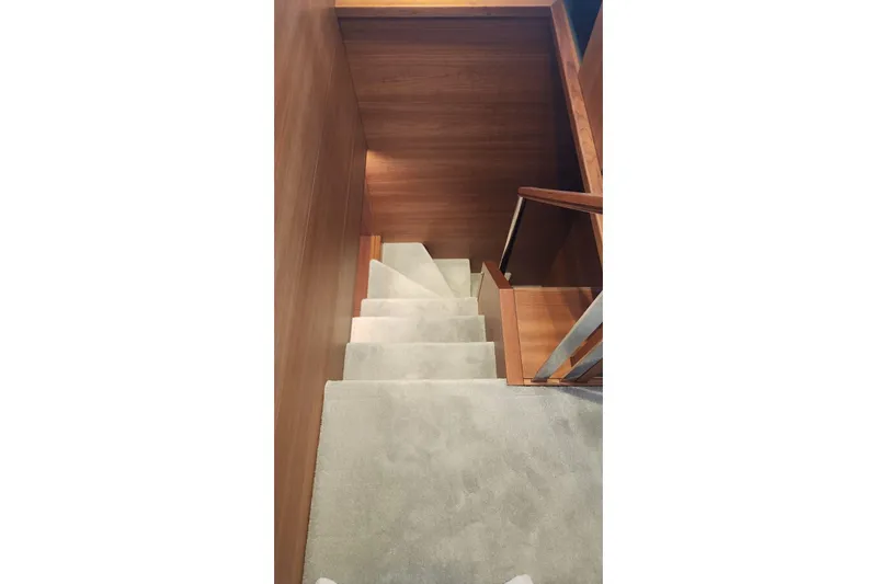 Alexstar Yacht Photos Pics Staircase with wooden walls inside 2021 Sunseeker Manhattan 68 yacht.
