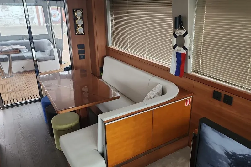 Alexstar Yacht Photos Pics Interior of 2021 Sunseeker Manhattan 68 yacht with dining area and modern decor.