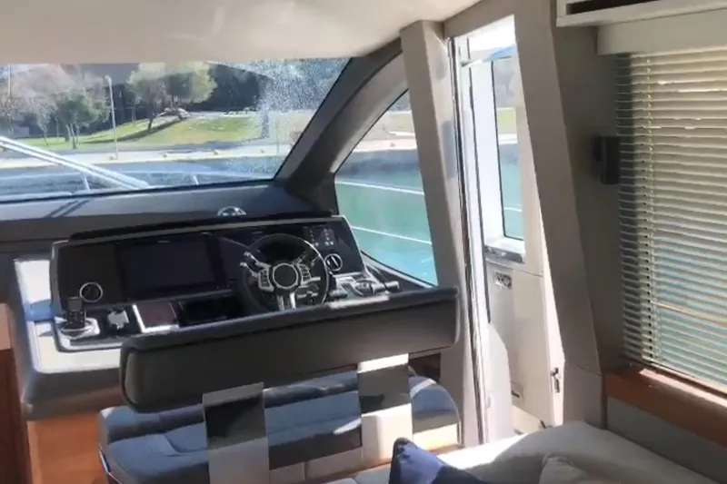 Alexstar Yacht Photos Pics Interior view of 2021 Sunseeker Manhattan 68 yacht helm station with modern controls.