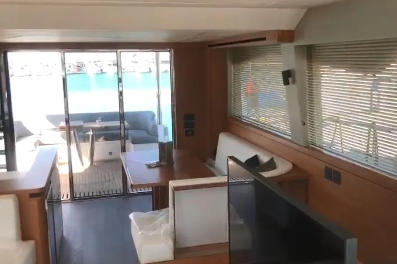 Alexstar Yacht Photos Pics Luxurious interior of 2021 Sunseeker Manhattan 68 yacht with modern furnishings and large windows.